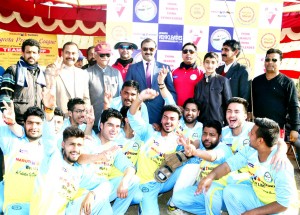Winners posing alongwith dignitaries and officials during a match of Nagrota Premier League T20 Cricket Tournament on Tuesday.