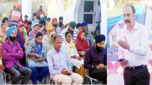 J&K Bank official addressing gathering during financial literacy camp.