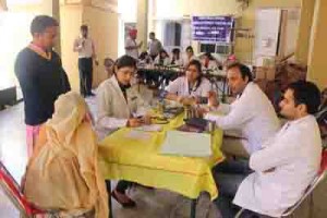A team of doctors providing services during a medical camp at Panchbakhtar Temple, Jammu.