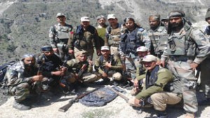 Army and police personnel pose with seizure at Basti, Doda on Wednesday. -Excelsior/ Tilak Raj