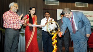 Chief guest lighting ceremonial lamp during inaugural of national seminar at JU on Friday.