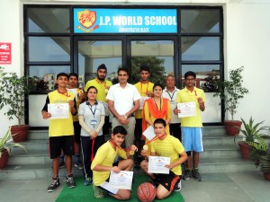 Winners of Inter-House Basketball Tournament posing for a group photograph at JP World School in Jammu.