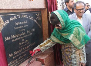 Chief Minister Mehbooba Mufti along with DyCM Dr Nirmal Singh laying foundation stone of ‘Multi Level Car Parking’ at Super Bazaar in Jammu on Saturday.