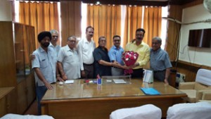 Delegation of Chamber of Traders Federation felicitating Principal Secretary Finance, Navin Choudhary during meeting in Jammu on Saturday.