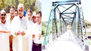 Minister for PWD, Abdul Rehman Veeri inaugurating motorable bridge at Thal Mohra on Saturday.