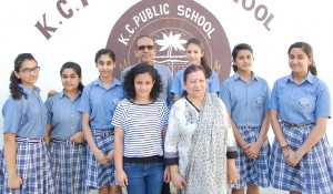 Students, who are going to participate in Students Exchange Programme at UK posing for group photograph with Principal Amarendra Mishra.