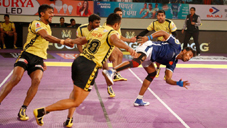 Players in action during Kabaddi match.