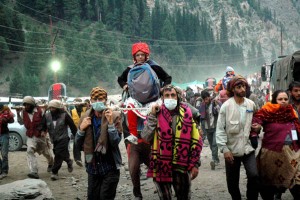 Porters carryig pilgrims on dandies at Trailpathri, on way to Holy cave shrine of Amarnath Ji on Friday. (UNI)
