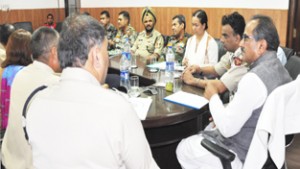 Deputy Chief Minister Dr Nirmal Singh chairing meeting at Jammu on Monday.