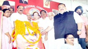 Provincial president National Conference, Devender Singh Rana along with other leaders paying tributes to Madr-e-Mehrban at Jammu.-Excelsior/Rakesh