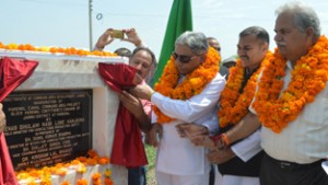 Minister for Agriculture Ghulam Nabi Lone Hanjura inaugurating canal command project at Pargwal on Friday.