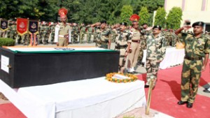 Additional DG BSF, Arun Kumar along with other officers and jawans paying homage to martyred BSF Head Constable, Jitender K Singh, at Jammu on Friday. -Excelsior/ Rakesh