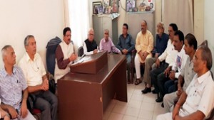 Dogra Sadar Sabha president Gulchain Singh Charak addressing press conference in Jammu on Friday.