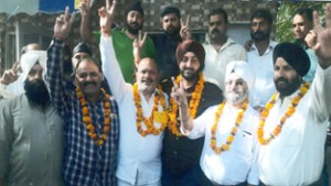 Elected representatives of Railway Station Taxi Operators Union posing for victory photo.