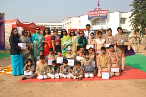 Chairperson PWWA, Vijaya Rajendra posing alongwith students and staff after inaugurating Bal Mela at J&K Police Public School in Jammu.