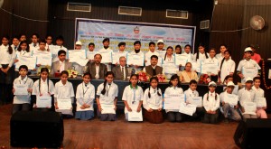 Winners of Painting Competition posing alongwith the chief guest and other dignitaries in Jammu on Tuesday.