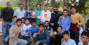 Wrestlers posing alongwith dignitaries during concluding ceremony of Wrestling Championship at Kathua.