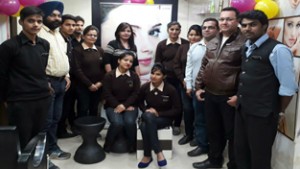 Management and team of beauticians of ‘Shades- the Salon’ posing for a group photograph.