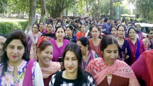 JU non-teaching and non-gazetted employees taking out protest march on Campus on Monday.