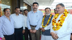 Speaker Kavinder Gupta posing with staff and proprietor of Kashmir Flavours after inaugurating restaurant at Channi Himmat on Thursday. 