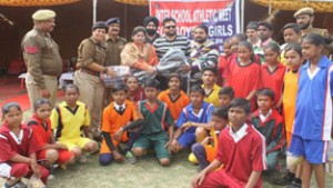 Dignitaries presenting sports kits to the participating palyers