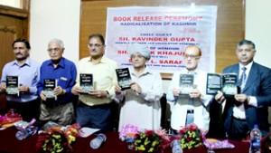 Speaker Kavinder Gupta, MLC Ashok Khajuria and other dignitaries releasing a book at Press Club Jammu on Saturday. -Excelsior/ Rakesh