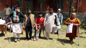 Physically challenged persons protesting against favouritism in distribution of wheelchairs.-Excelsior/Aabid Nabi