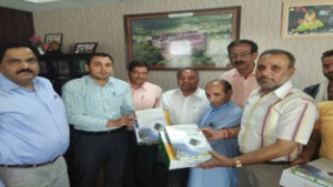 DC Reasi Ravinder Kumar and Executive Director Salal Power Project, A G Ansari handing over solar lights for Kounsarnag Yatra.