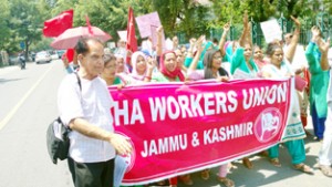 ASHA workers taking out protest march at Jammu on Saturday.