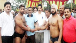 Wrestlers being felicitated by MLA Udhampur, Pawan Kumar Gupta on Friday.