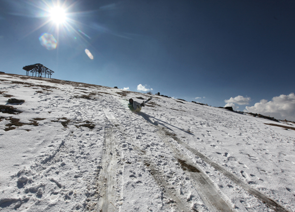 A tourist enjoys snow at Padri Pass in Bhaderwah on Friday. -Excelsior ...