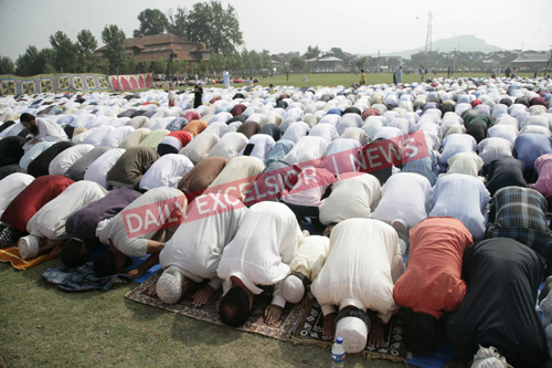 People offering Eid prayers at Eidgah in Srinagar on Wednesday ...