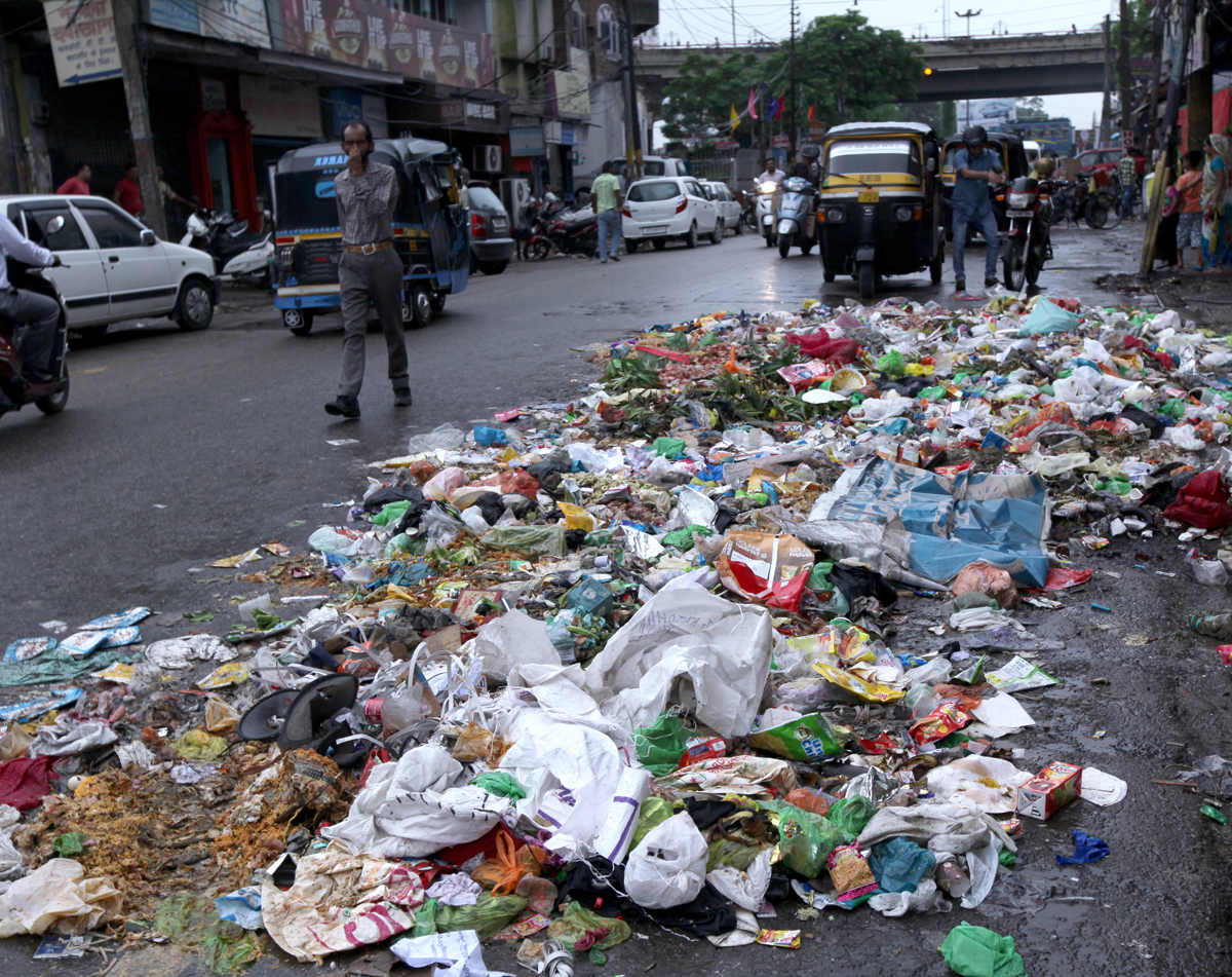 Stinking garbage on a road in Jewel area of Jammu forcing a commuter to ...