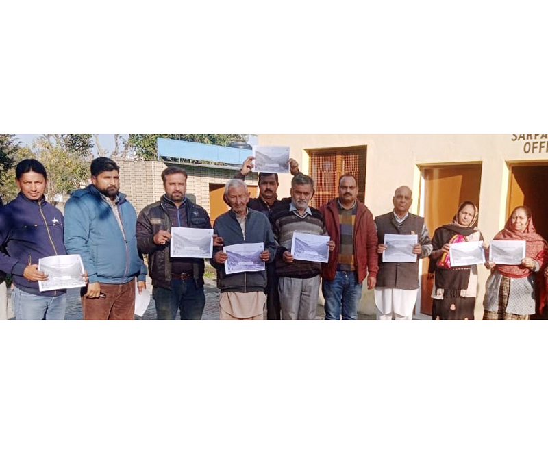 Beneficiaries displaying digital land passbooks at Nagrota on Friday.